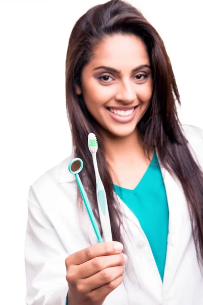 Dentist doctor holding brush and mirror — Stock Photo, Image