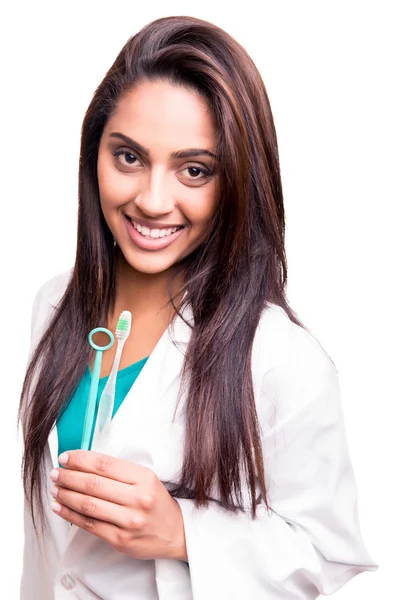 Dentist doctor holding brush and mirror — Stock Photo, Image