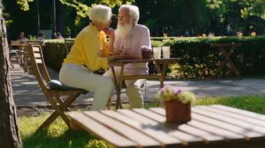 Amazing looking couple old looking very romantic speeding good time together enjoy the moment at the cafe. Shot on ARRI Alexa Mini.