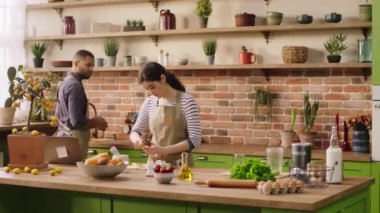 Good looking couple very lovely multiethnic in the kitchen preparing the healthy breakfast in the morning they cooking together at the kitchen island
