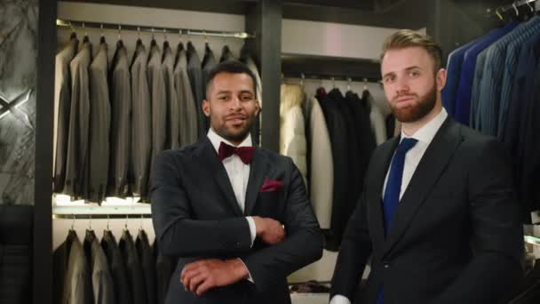 Luxury Suit Shop Two Good Looking Men Suit Posing Front – Stock-video
