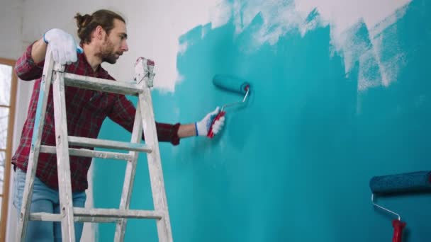 Charismatic Caucasian Looking Using Wall Brush Roller Paint Walls Standing — Video