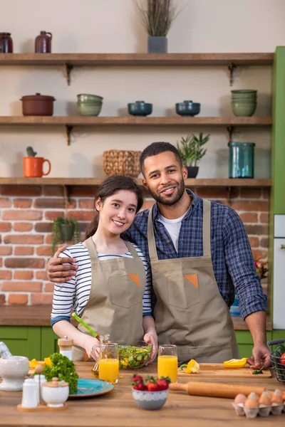 Multiracial Couple Posing Front Camera Kitchen Island Morning While Preparing — Stockfoto