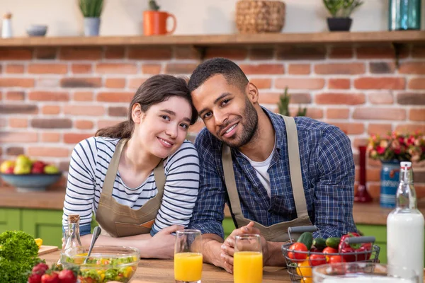 Charismatic Couple Multiethnic Posing Front Camera Kitchen Island Morning While — Stockfoto