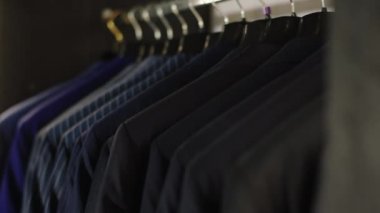 Taking video details of luxury suit shop new collection of suits with high quality and couture concept of small business entrepreneur design couture. Shot on ARRI Alexa Mini
