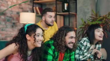 .Happy evening day for a attractive group of friends watching a football match together they getting excited after their team gives a goal they start to screaming. Shot on ARRI Alexa Mini