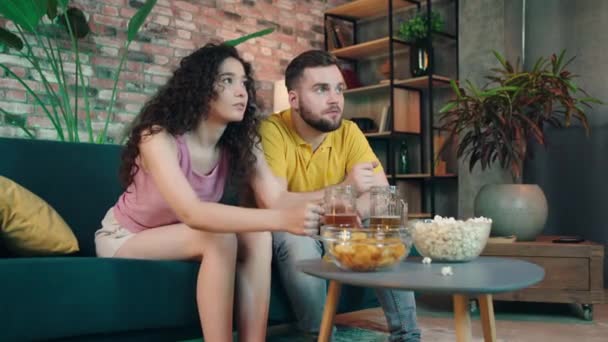 Home Living Room Attractive Couple Watching Favourite Sport Match Team — Stock Video