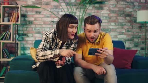 Very Good Looking Couple Excited Watching Football Match Smartphone Getting — 비디오