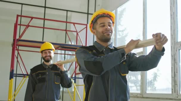 Modern Construction Site Industrial Building Construction Two Changed Multiracial Constructors — Vídeo de Stock