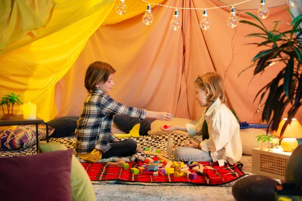 Two Cute Boys Playing Airplanes Blanket Tent Lightbulbs Hung Top — 스톡 사진