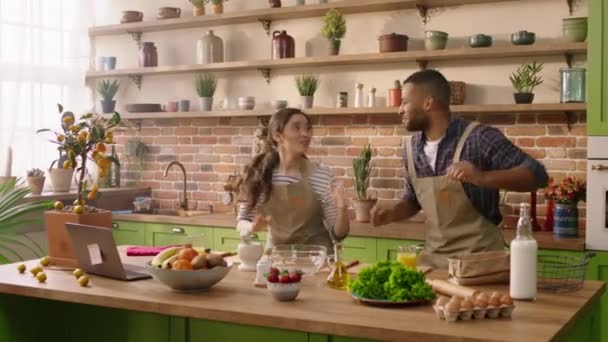 Happy Excited Multiracial Couple Have Perfect Morning Together Dancing Kitchen — Vídeo de Stock