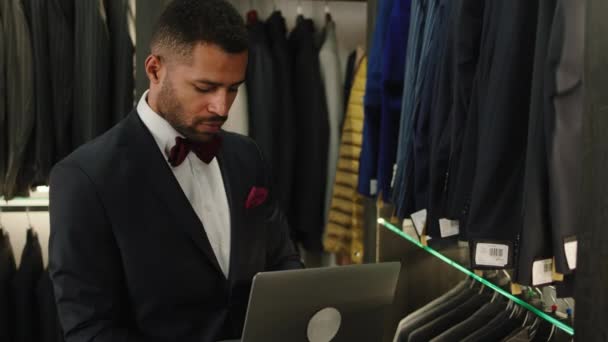 Charismatic Designer Man Luxury Suit Shop Take Laptop Looking His — Vídeos de Stock
