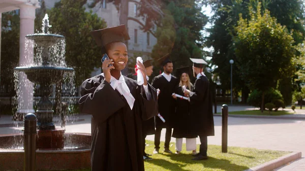 Charismatic One Black Lady Student Excited Speaks Phone Graduation She — Stok fotoğraf