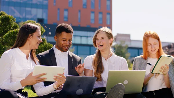 Young Students Multiracial Doing Homework Group Using Laptops Tablets Studying — стоковое фото