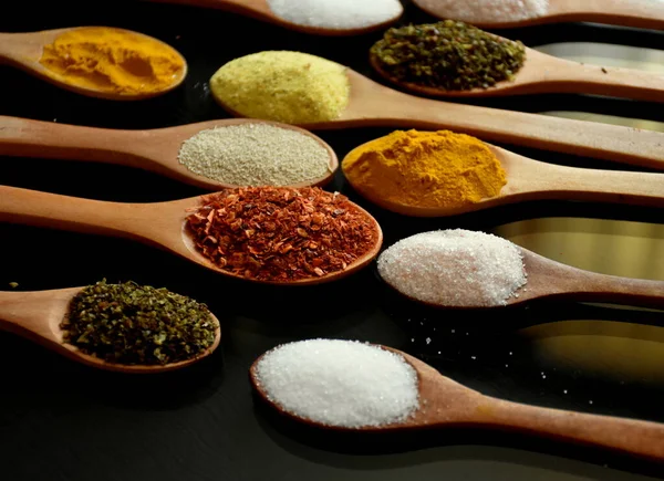 Various Spices Wooden Spoons Black Background — Foto Stock