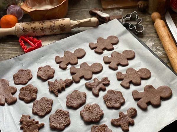 christmas homemade gingerbread cookies and ingredients for baking.