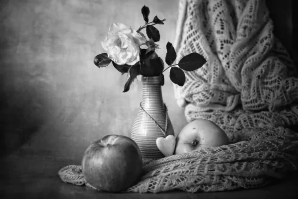 black and white of apples on table