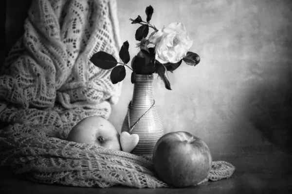 black and white of apples on table