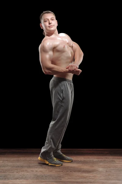 Healthy muscular young man in studio — Stock Photo, Image