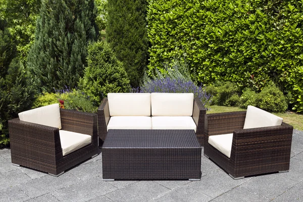 Outdoor garden furniture group in green garden