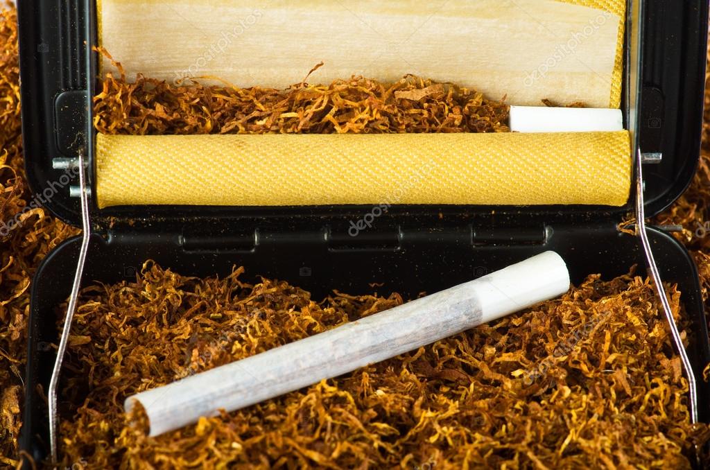Tobacco and cigarette roller Stock Photo by ©Orlando.B 13147113