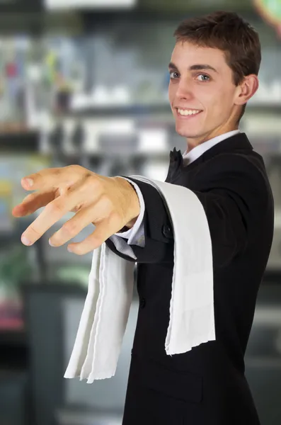 Young waiter in uniform — Stock Photo, Image