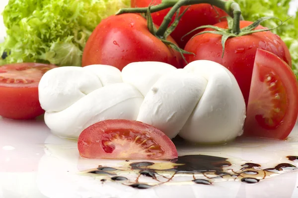 Mozzarella tomatoes and fresh salad — Stock Photo, Image