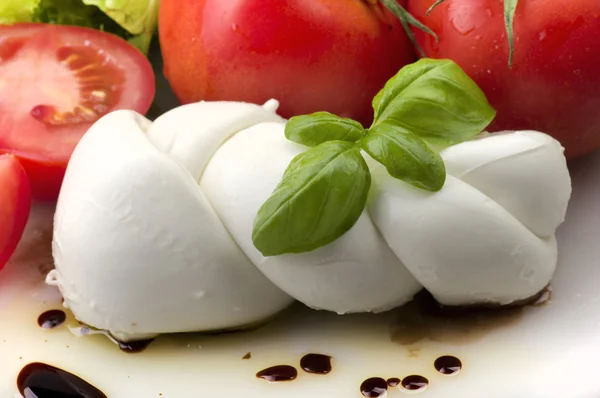 Mozzarella tomatoes and fresh salad — Stock Photo, Image