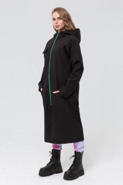 Beautiful girl in a raincoat. Front view. Raincoat template mock-up