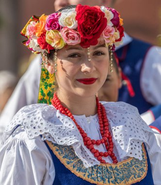 ROMANIA, TIMISOARA - JULY 7, 2022: Young girl from Poland in traditional costume, present at the international folk festival, 
