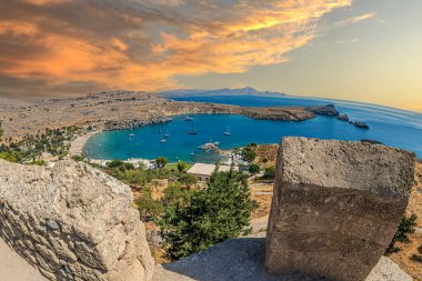 View of Lindos Beach from the height of the Acropolis of Lindos. One of the most beautiful beaches in Greece, located on the SE side of Rhodes islands, next to the old village of Lindos.