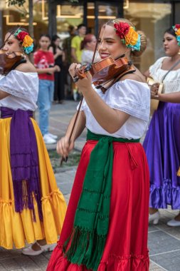 TIMISOARA, ROMANIA - JULY 7, 2022: Young Mexican singer on the violin in traditional costume, present at the international folk festival, 