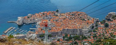 Dubrovnik, Croatia. Overview of the medieval old town with fortified walls and the tourist harbor. It was included in 1979 on the UNESCO list. Filming location for the movie Game of Thrones.