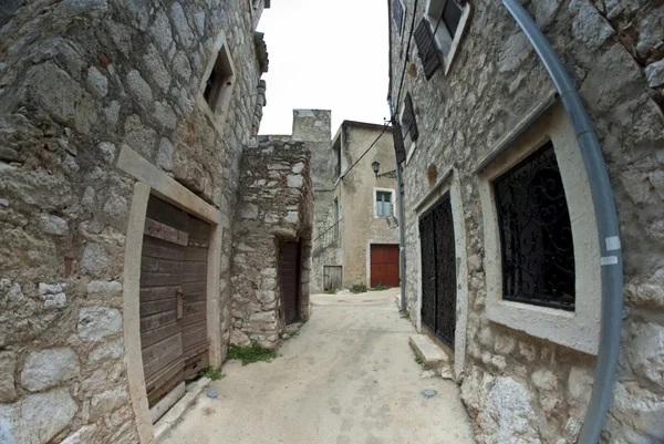 Narrow old street in stone, Croatia — Stock Photo, Image