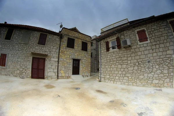 Old street of stone houses, bad weather — Stock Photo, Image
