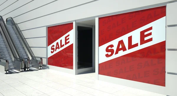 Sale on shopfront windows and escalator — Stock Photo, Image