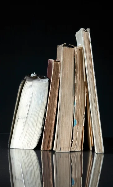Pile of old books with vintage pages reflected — Stock Photo, Image