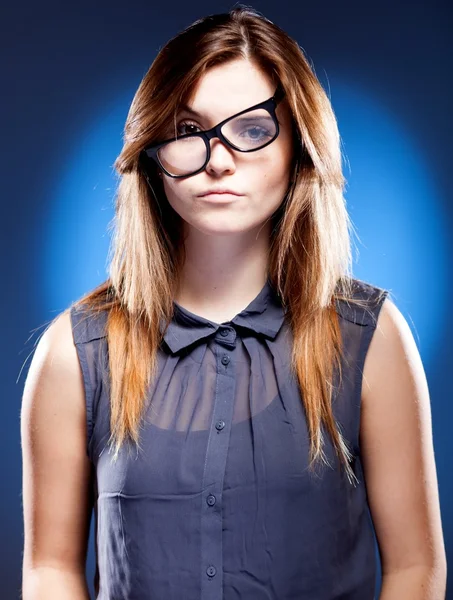 Disappointed young woman with nerd glasses has objections — Stock Photo, Image