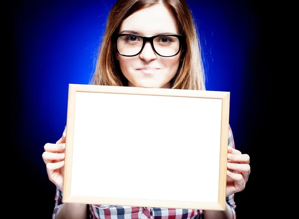 Smiling woman with nerd glasses holding empty frame — Stock Photo, Image