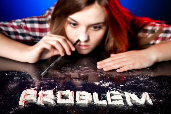 Woman snorting cocaine or amphetamines, drug problem