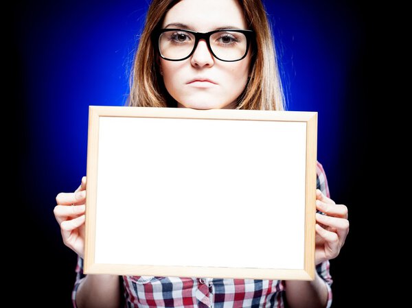 Woman with nerd glasses holding empty frame, copyspace