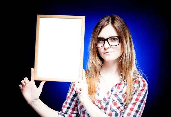 Woman with nerd glasses holding empty frame, copyspace — Stock Photo, Image