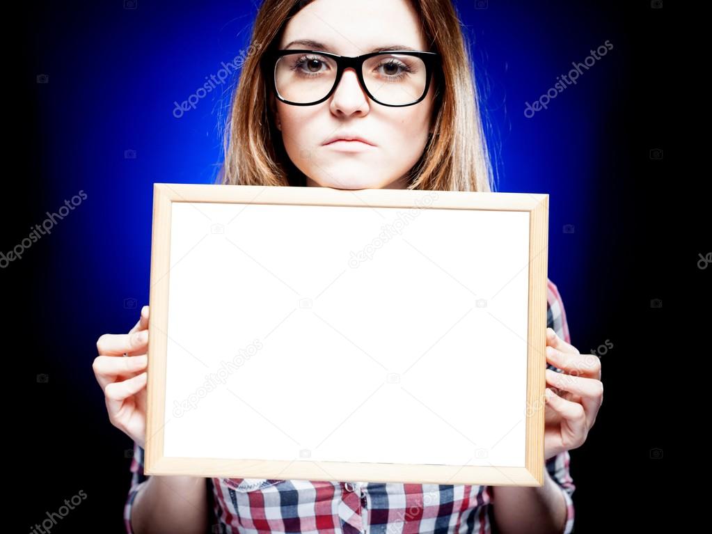 Woman with nerd glasses holding empty frame, copyspace