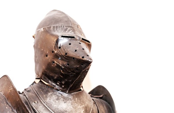 Vintage knight's armor suit on white background
