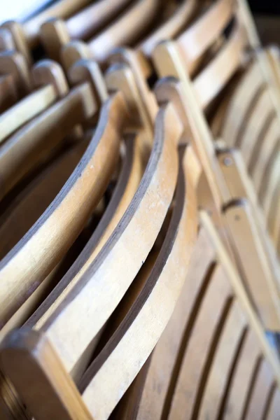 Stack of old wooden school chairs — Stock Photo, Image