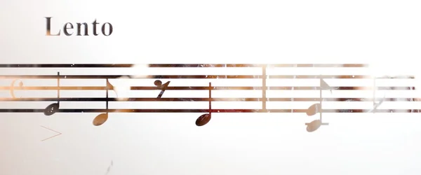 Musical notes on frosted glass, art background — Stock Photo, Image