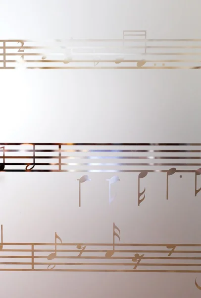 Музичні ноти на матовому склі, арт фоні — стокове фото