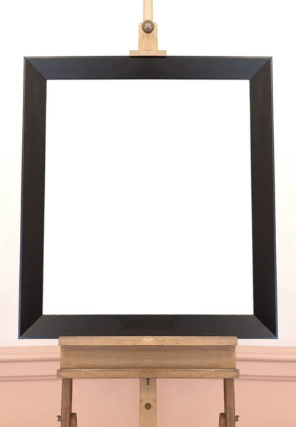 Blank empty frame on painting easel, background — Stock Photo, Image