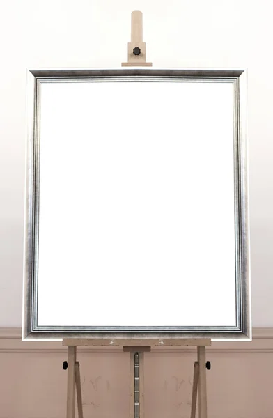 Blank empty frame on painting easel, background — Stock Photo, Image