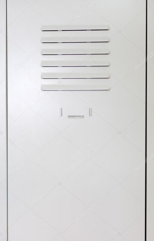 Empty white school metal locker